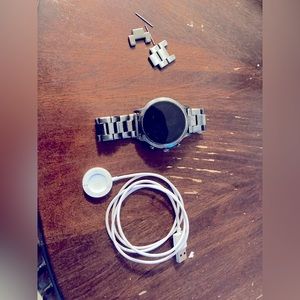 Gen 4 fossil smartwatch with grey metallic band.